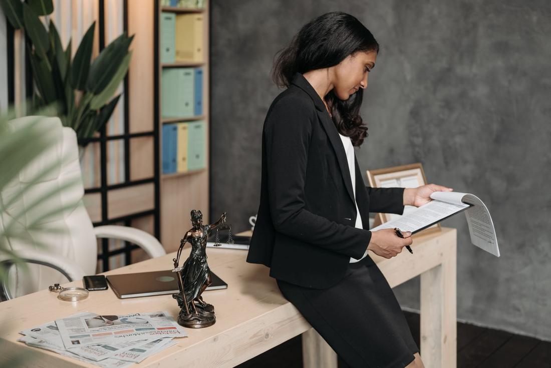 An attorney reviewing documents in a modern law office